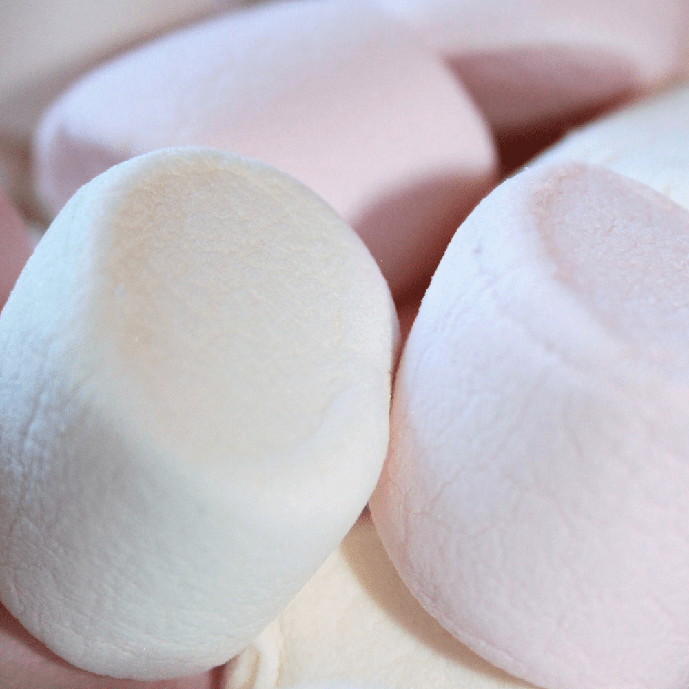 White marshmallows stacked close together.
