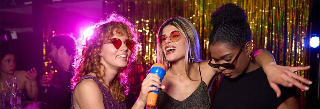 Friends singing together at a vibrant karaoke hire event in Doncaster