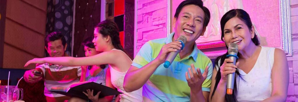 Man performing karaoke at a colourful Doncaster party hire